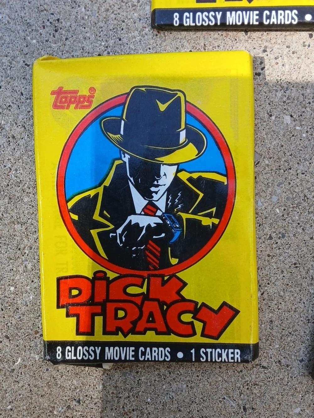 five unopened packs of 1990 Topps Dick Tracy movie trading cards.